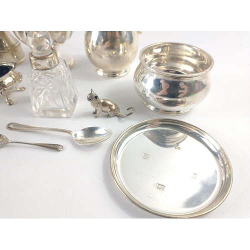 210 - An interesting collection of hallmarked silver to include a creamer and sugar bowl Birmingham 1965, ... 