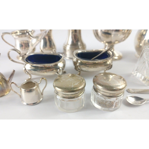 210 - An interesting collection of hallmarked silver to include a creamer and sugar bowl Birmingham 1965, ... 