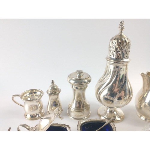 210 - An interesting collection of hallmarked silver to include a creamer and sugar bowl Birmingham 1965, ... 