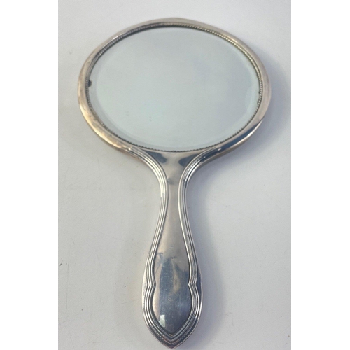 211 - A sterling silver mirror and two brush silver backed set.  Filled mirror but glass in good condition... 