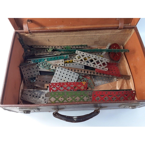 253 - A small suitcase with some early MECCANO parts of interest.#254