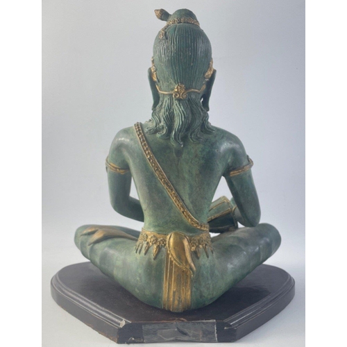 364 - A lovely heavy cast metal drumming oriental Buddah on plinth.  Standing 30cm high approx this is a v... 