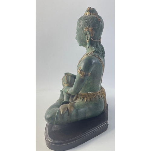 364 - A lovely heavy cast metal drumming oriental Buddah on plinth.  Standing 30cm high approx this is a v... 