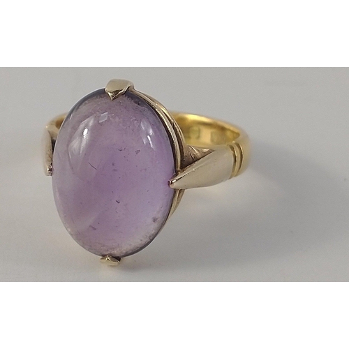 39 - A 22ct stamped yellow gold cabochon oval amethyst ring size L, stone is 1.5 x 1cm, gross weight 4.50... 