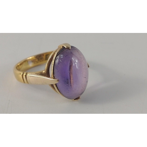 39 - A 22ct stamped yellow gold cabochon oval amethyst ring size L, stone is 1.5 x 1cm, gross weight 4.50... 