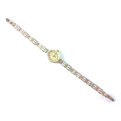 58 - A ladies 375 stamped cocktail watch by WOODFORD with 3 bar gate bracelet, gross weight 9.38g approx#... 