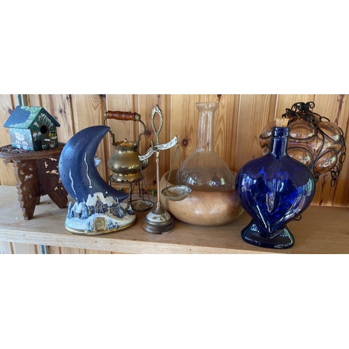 675 - An UNUSUAL mixed lot to include a heart-shaped blue glass bottle - a carved wooden bowl - a carved I... 