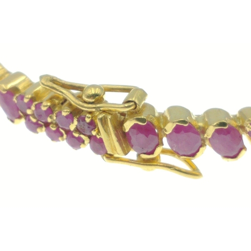 68 - A rather impressive gold and red stone (RUBY? to be tested) bracelet from the middle east carrying 9... 