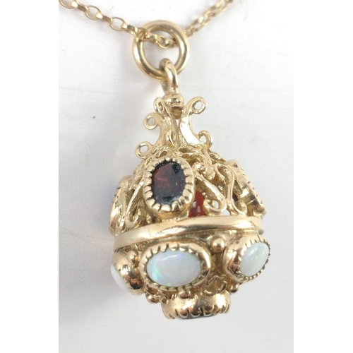 71 - A small pomander style pendant length 2cm approx, stamped 375, set with 5 opals plus 5 red stones on... 