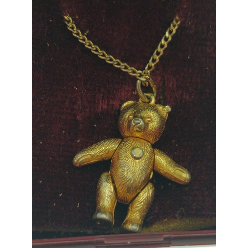 88 - A lovely wee articulated teddy bear pendant 2cm long on a 44cm long chain and a ring size P#88