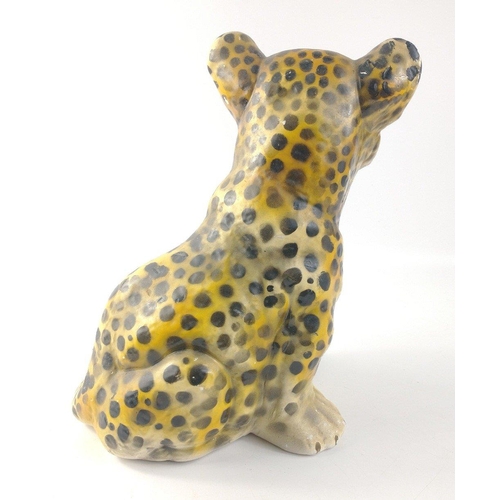 139 - A plaster leopard cub standing approx 25cm high.  A few chips missing from the surface but still a c... 
