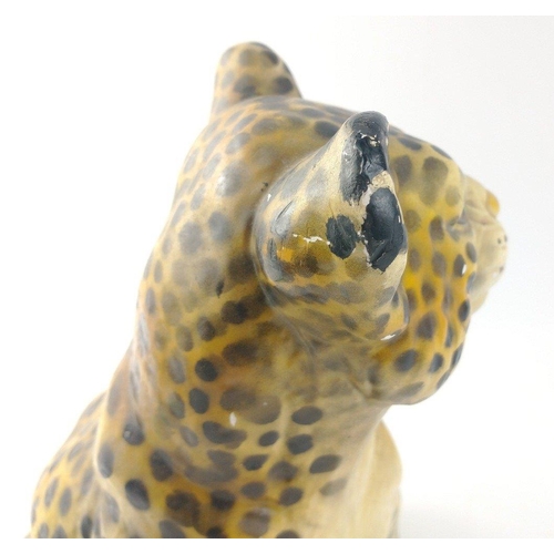 139 - A plaster leopard cub standing approx 25cm high.  A few chips missing from the surface but still a c... 