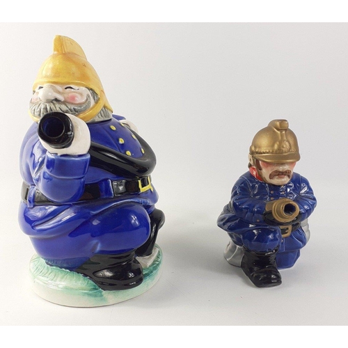 144 - Two collectable fireman teapots. Larger approx 20cm tall, other 14cm tall approx#144