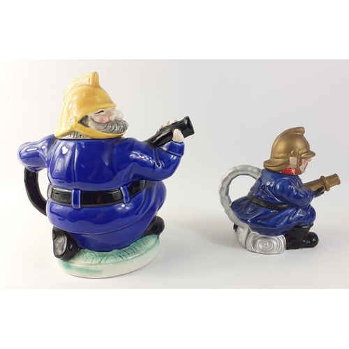 144 - Two collectable fireman teapots. Larger approx 20cm tall, other 14cm tall approx#144