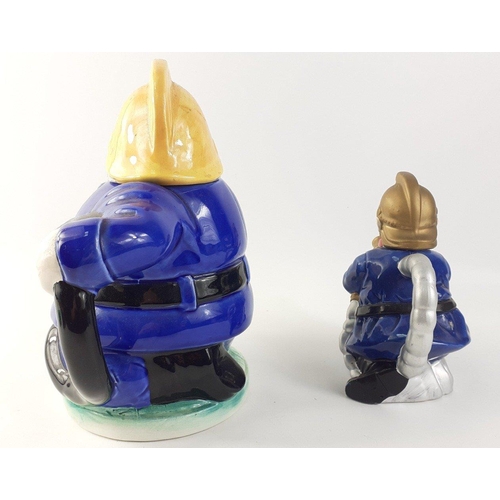144 - Two collectable fireman teapots. Larger approx 20cm tall, other 14cm tall approx#144