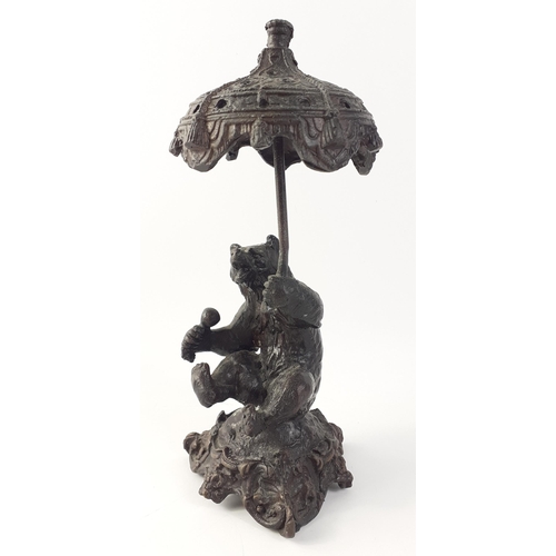 149 - A bear holding umbrella approx 20cm tall#149