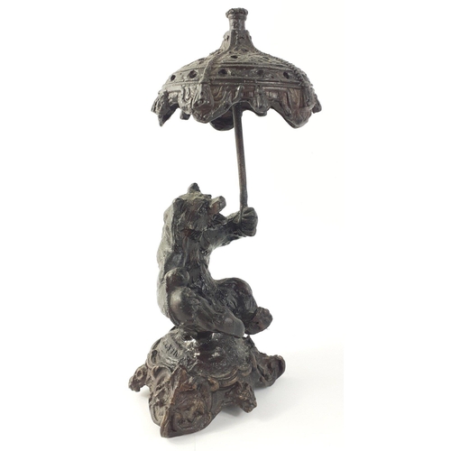 149 - A bear holding umbrella approx 20cm tall#149