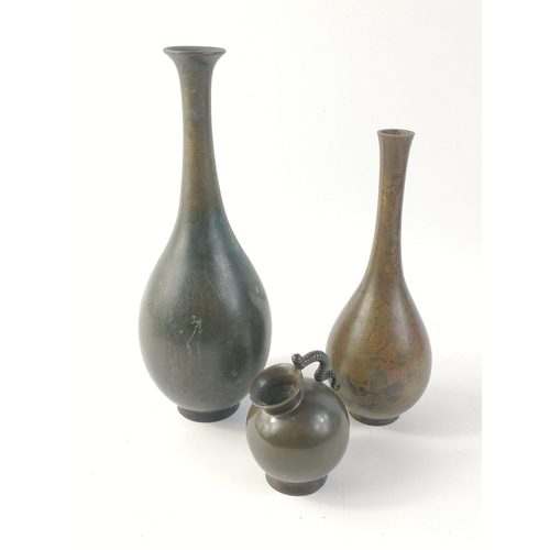 154 - A small collection of antique-style brass ornaments to include a larger long-necked vase approx. 7cm... 