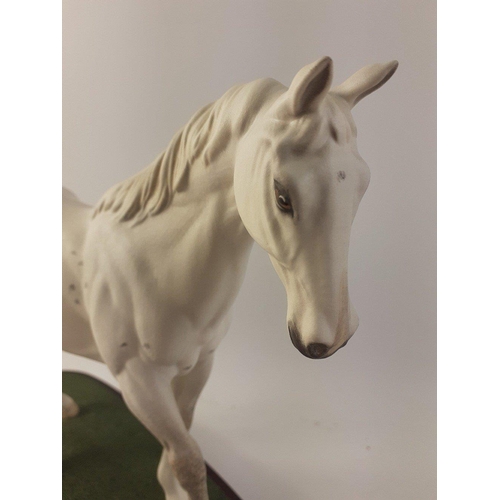 162 - BESWICK RACE HORSE - DESERT ORCHID. A Connoisseur Model by Beswick England on a wooden plinth. 23cm ... 