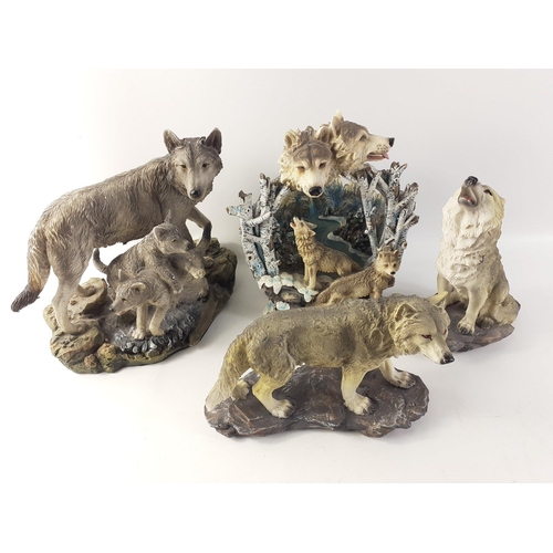 167 - A collection of WOLF FIGURES to include a rather impressive mountain diorama (23cm high approx), A C... 