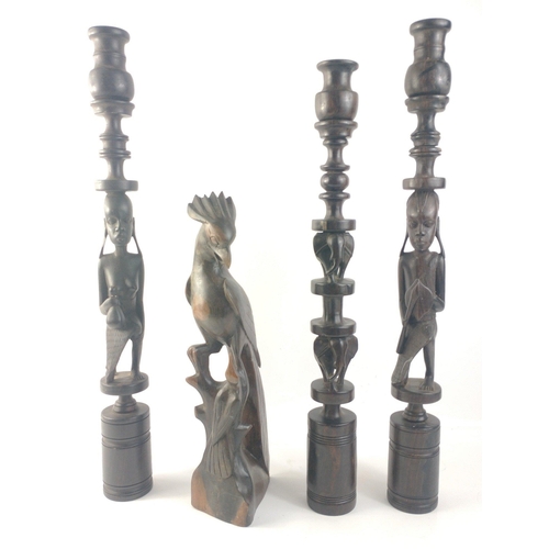 175 - Tribal ware consisting of 1x bird, and 3 tall candlesticks tallest approx 51cm tall#176