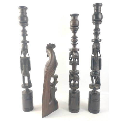 175 - Tribal ware consisting of 1x bird, and 3 tall candlesticks tallest approx 51cm tall#176