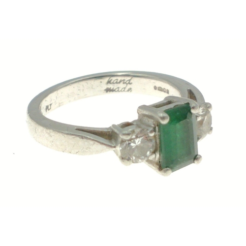 3 - PLATINUM hand-made ring with a stunning EMERALD 0.89ct flanked by two round brilliant cut diamonds a... 