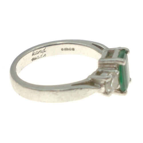 3 - PLATINUM hand-made ring with a stunning EMERALD 0.89ct flanked by two round brilliant cut diamonds a... 