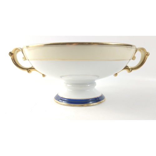 306 - An attractive porcelain bowl (23cm dia), with heavy gilt decoration on a pedestal standing 11cm tall... 