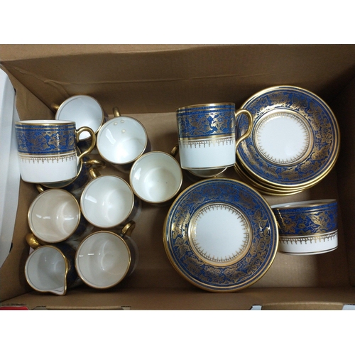 313 - A lovely wee coffee set in a rich blue with gilt highlights, comprising 10 coffee cans, 12 saucers, ... 