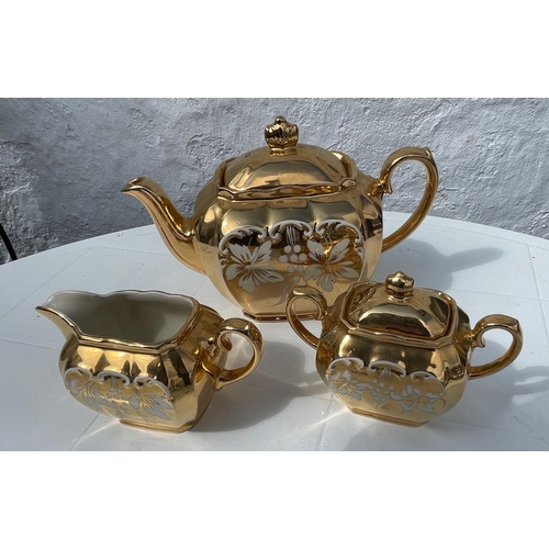 314 - A vintage SADLER gilt tea service comprising teapot, milk jug and sugar bowl,#322