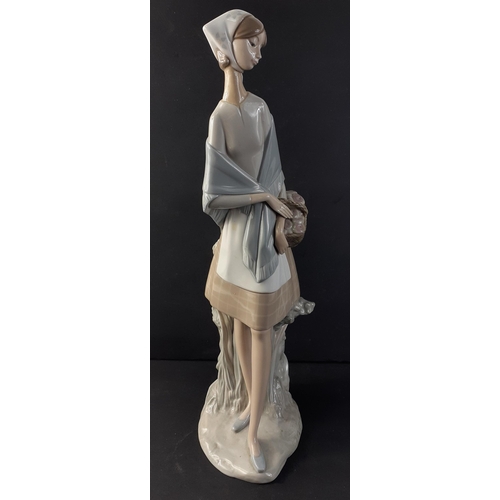 324 - A tall LLADRO figurine of a young woman with basket stands 47cm tall approx#332