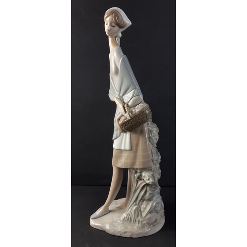 324 - A tall LLADRO figurine of a young woman with basket stands 47cm tall approx#332