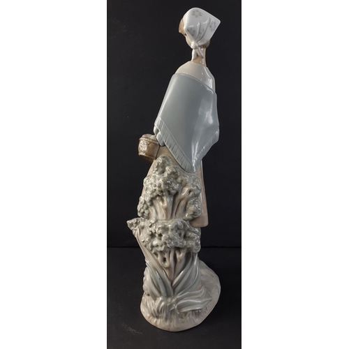 324 - A tall LLADRO figurine of a young woman with basket stands 47cm tall approx#332