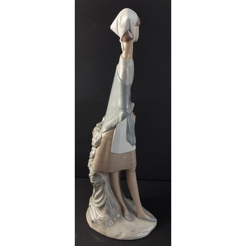 324 - A tall LLADRO figurine of a young woman with basket stands 47cm tall approx#332