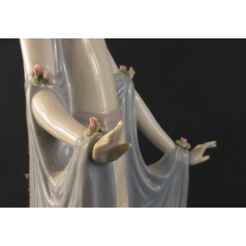 330 - A beautiful tall LLADRO figure of a svelte female in hat and flowing gown. Handmade in timelessly co... 