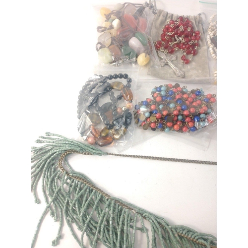 43 - A collection of  costume necklaces made of natural materials such as semi-precious stones as well as... 