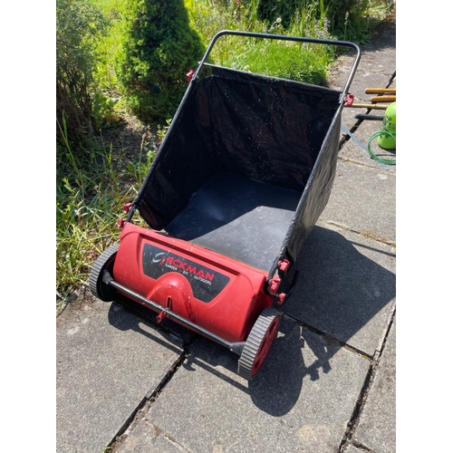 571 - A garden ECKMAN branded leaf wheeled brush with large collecting basket for all those nuisance autum... 