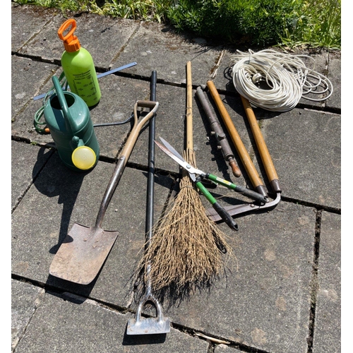 572 - A collection of useful garden tools to include a watering can and green sprayer etc#600