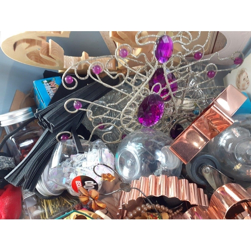 611 - A box of bric-a-brac to include Christmas decorations, cookie cutters, small dolls in national costu... 