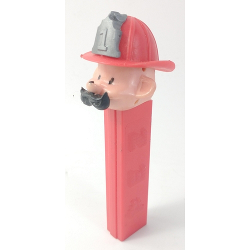 310 - A vintage FIREMAN PEZ  dispenser with hat and moustache, no feet, Hong Kong Red Stem Fire Fighter#65... 
