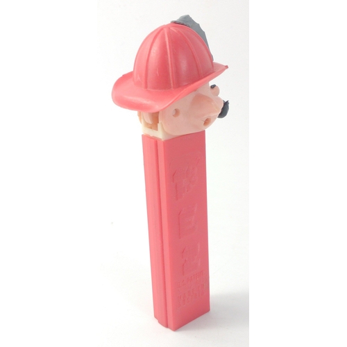 310 - A vintage FIREMAN PEZ  dispenser with hat and moustache, no feet, Hong Kong Red Stem Fire Fighter#65... 