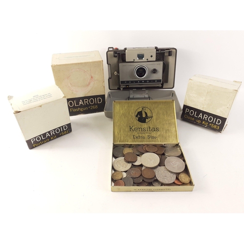 357 - A vintage POLAROID land camera 230 with a Flashgun (268), portrait kit (581) and a close-up kit (583... 