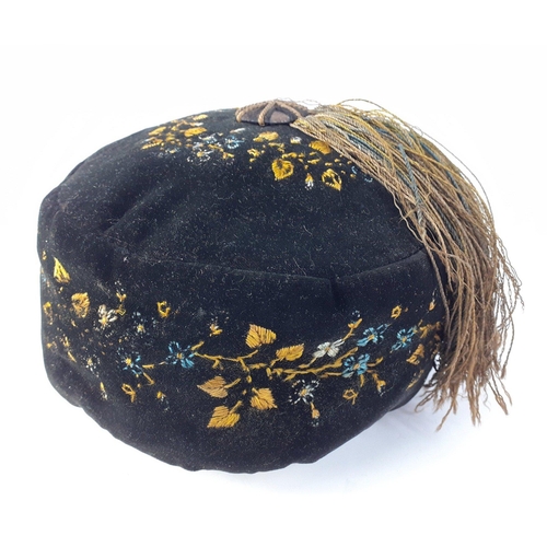 382 - A Victorian silk lined gentleman's smoking cap with tassel. Rather pretty embroidery throughout.  Me... 