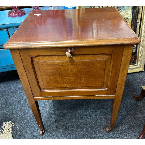 409 - An Edwardian bedside pot cupboard with original porcelain casters and drop down door.  Dimensions 21... 