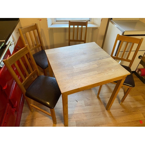 416 - A nice wee dining set with a light oak style dining table and four dining chairs with brown leathere... 