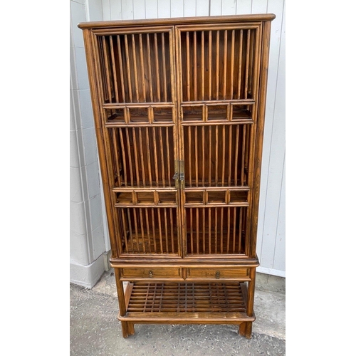 431A - A tall ORIENTAL display cabinet/bookcase with three shelves and two drawers and a further storage sh... 