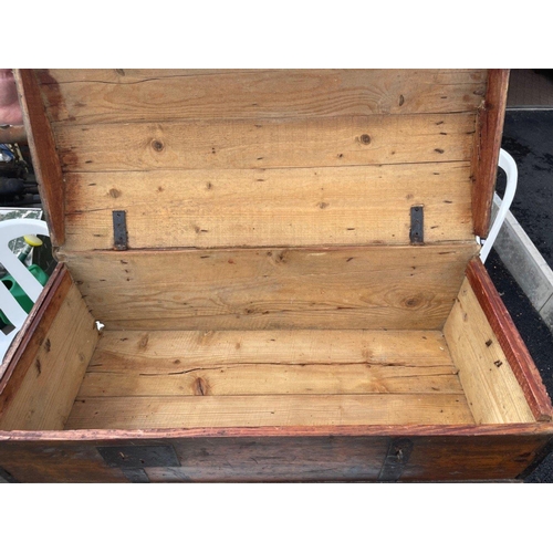 475 - An old medium sized dome-top TRUNK with side carry handles - 85cm length x 40cm depth x 34cm height ... 