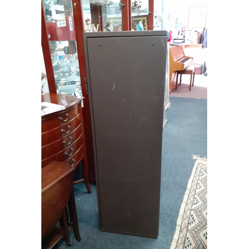 246 - A tall racked metal gun cabinet with keys standing 130cm tall and in good useable condition.#247