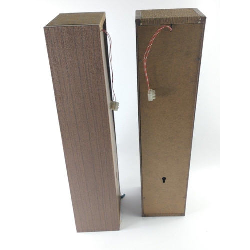 271 - A pair of discreet speakers in wood with bronze fabric centres which can be wall-mounted measuring 6... 